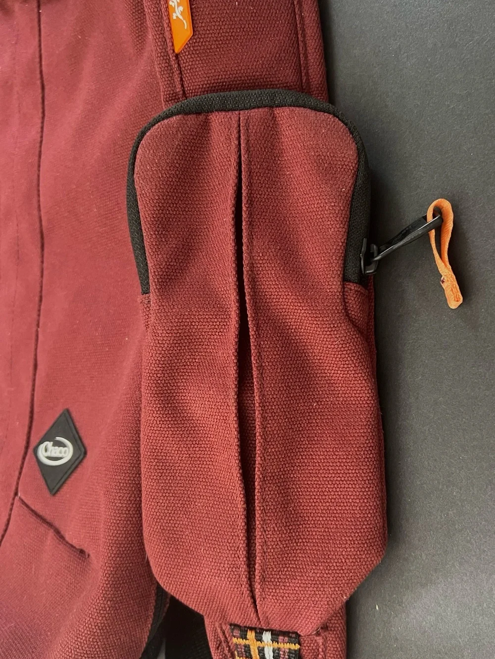 Chaco Men's Burgundy Red Sling Bag with Orange, Black and White Strap Detail